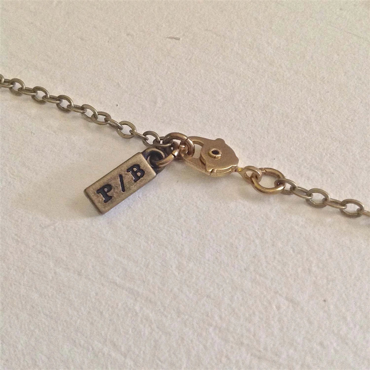 "Cache" Brass Acorn Canister Pendant Necklace