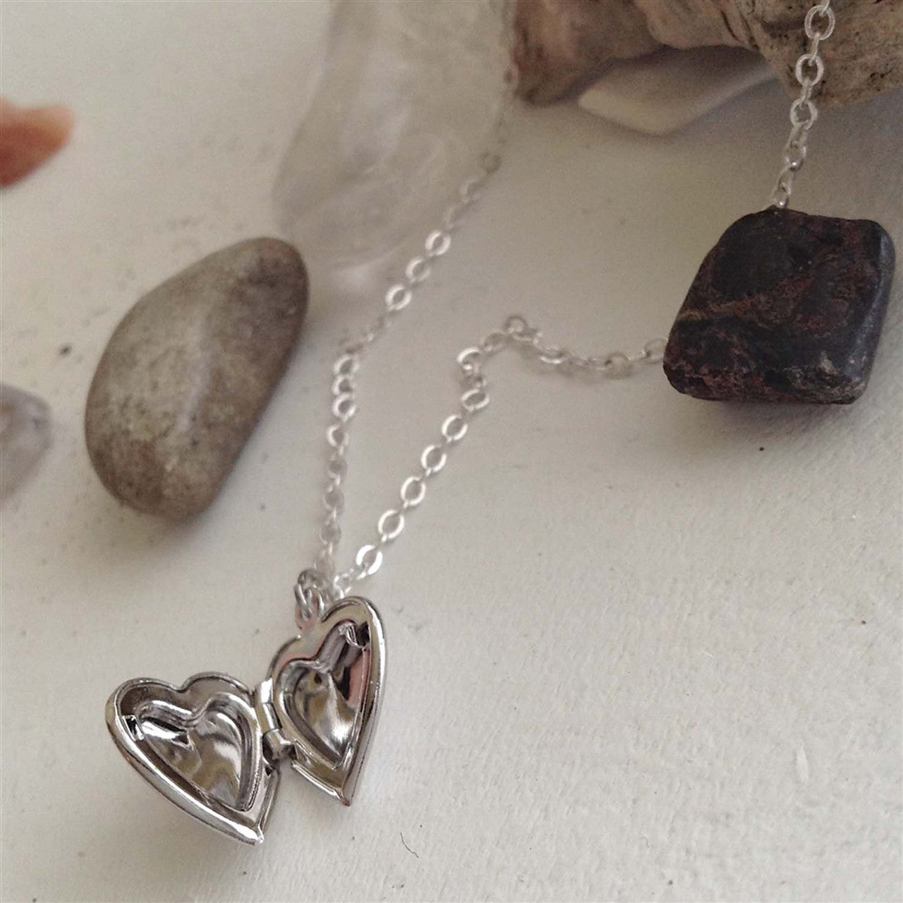 "Total Eclipse of the Heart" Tiny Heart Shaped Locket in Silver