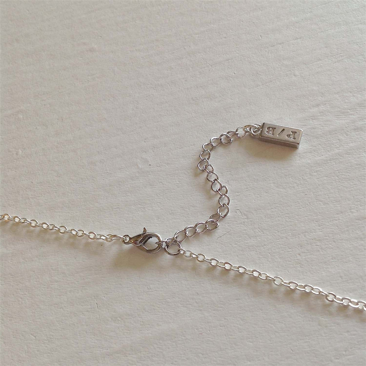 "Total Eclipse of the Heart" Tiny Heart Shaped Locket in Silver